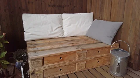Smooth motion shot of pallet couch on balcony. Stock Footage 109379780