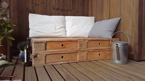 Smooth motion shot of pallet couch on balcony. Stock Footage 109379973