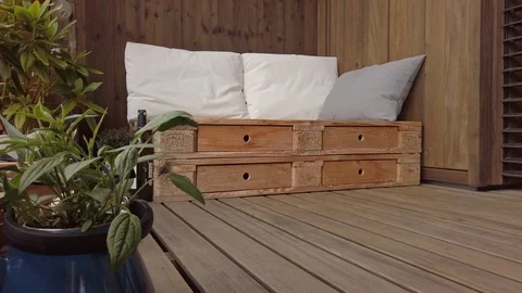 Smooth motion shot of pallet couch on balcony. Stock Footage 109380141