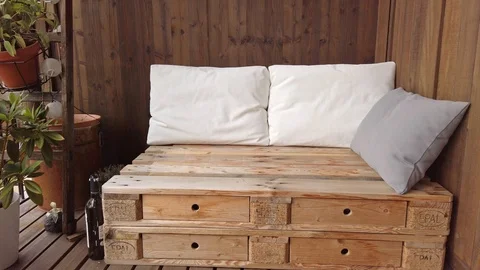 Smooth motion shot of pallet couch on balcony. Stock Footage 109380261