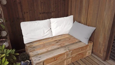 Smooth motion shot of pallet couch on balcony. Stock Footage 109380348