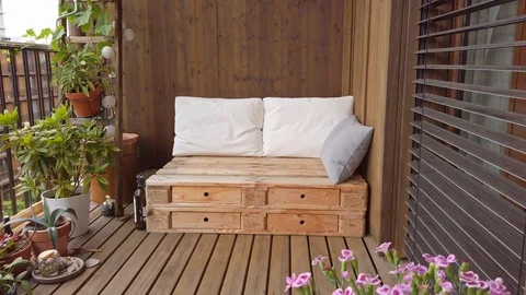 Smooth motion shot of pallet couch on balcony. Stock Footage 109380717