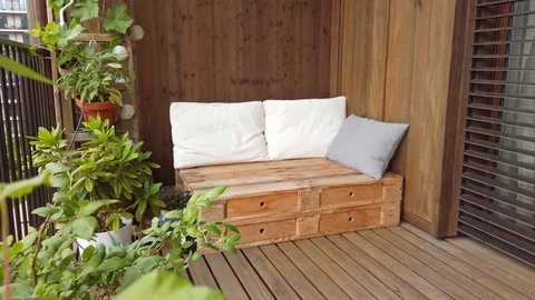 Smooth motion shot of pallet couch on balcony. Stock Footage 109380786