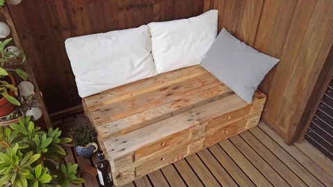 Smooth motion shot of pallet couch on balcony. Stock Footage 109380856