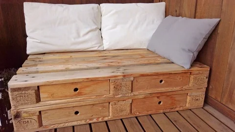 Smooth motion shot of pallet couch on balcony. Stock Footage 109380921