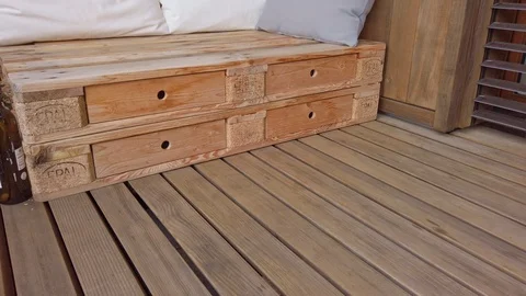 Smooth motion shot of pallet couch on balcony. Stock Footage 109381071