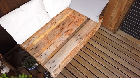 Smooth motion shot of pallet couch on balcony. Stock Footage 109381132