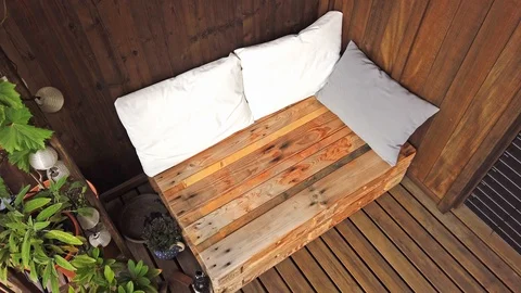 Smooth motion shot of pallet couch on balcony. Stock Footage 109381341