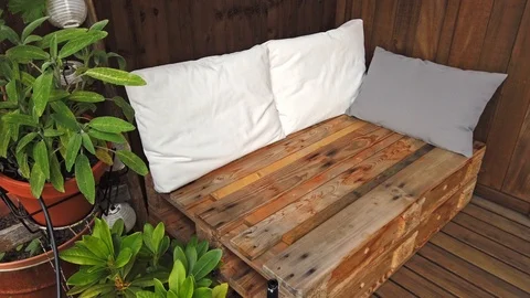 Smooth motion shot of pallet couch on balcony. Stock Footage 109381404