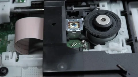 Smooth movement along the inside of a disassembled PC dvd drive Stock Footage 131152679