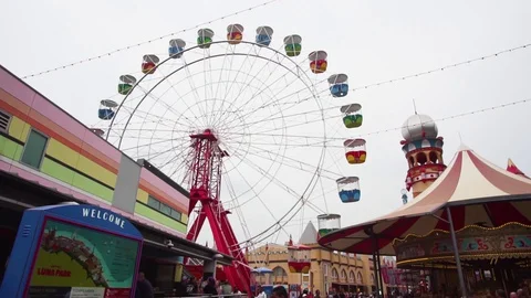 Smooth movement around fairground ferris wheel ride Stock Footage 127869191
