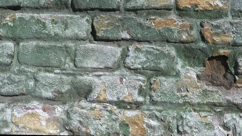 Smooth movement of the camera along the old brick wall Stock Footage 112980899