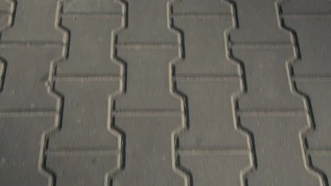 Smooth Movement Of The Camera Along The Paving Slabs Of Gray Stock Footage 155441518