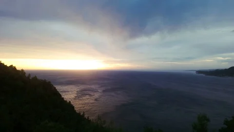 Smooth movement of the camera on a background of sunset at sea with part of the Video stock 127360929