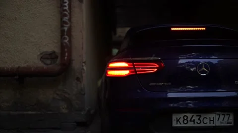 Smooth movement of the car around the yard. Stock Footage 150107002