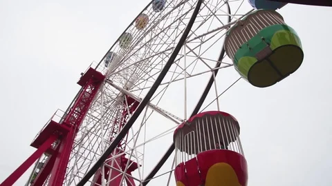 Smooth movement underneath fairground ferris wheel ride at park Stock-Footage 127871678