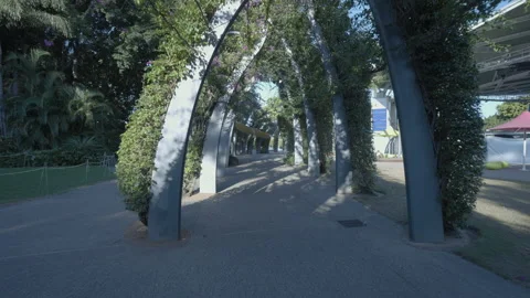 Smooth moving shot of walking along a walkway with arbour in Brisbane, Australia Stock-Footage 205822601