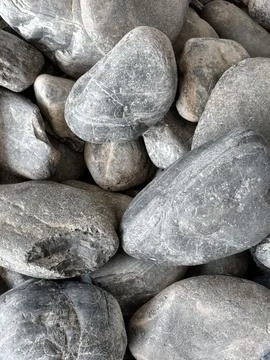 Smooth natural river pebbles background texture. Round sea rock stones top vi 스톡 사진