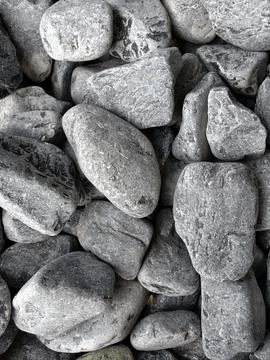 Smooth natural river pebbles background texture. Round sea rock stones top vi 写真素材