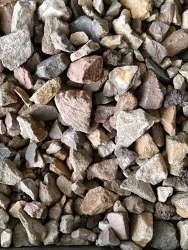 Smooth natural river pebbles background texture. Round sea rock stones top view Stock-Fotos