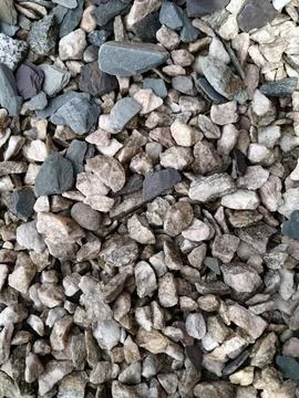 Smooth natural river pebbles background texture. Round sea rock stones top view Stock Photos