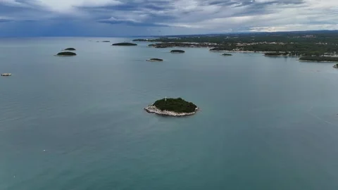 Smooth orbit around a small uninhabited island in turquoise water Stock Footage 322045503