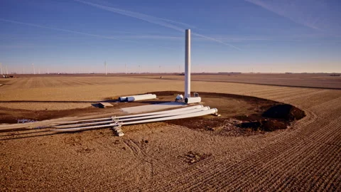 Smooth orbit shot of windmill construction against open sky Stock Footage 329223917