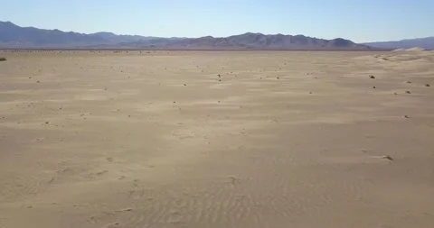 A smooth pan of the big dunes in the Nevada desert Stock Footage 138376960