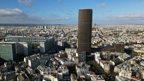 Smooth panning drone movement near the amazing Montparnasse Tower, Paris Stock Footage 295937401