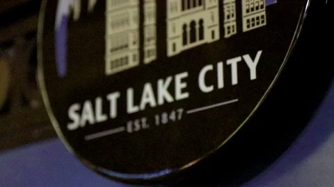 Smooth panning motion around vibrant and shiny "Salt Lake City" sign. Stock Footage 96385577