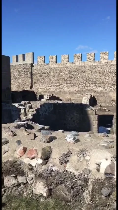 A smooth panning shot across the stone walls and battlements of an ancient 動画素材 333376724