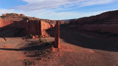 Smooth Parallax Drone Orbit Revealing the Full Scale of a Thin Red Rock Desert Stock Footage 332749188