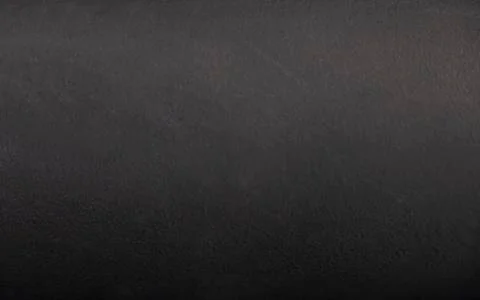 Smooth pattern on black color gradient paint of concrete floor and wall. Stock Photos