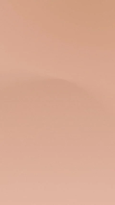 Smooth peach gradient seamless loop background in 4K. Soft curves. Stock Footage 309956980