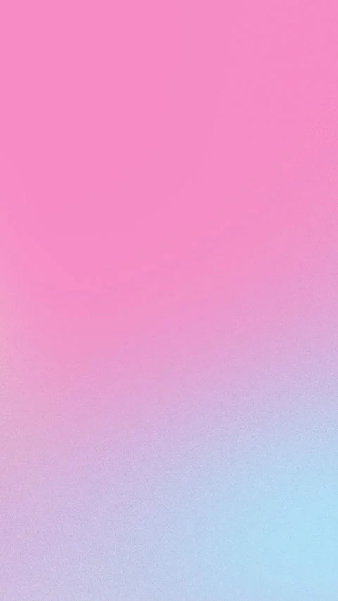Smooth pink to light blue gradient with soft grain texture. Seamless loop Stock Footage 309956470