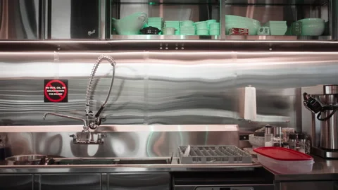 Smooth push-in toward professional baking equipment including a commercial Stock Footage 334634642
