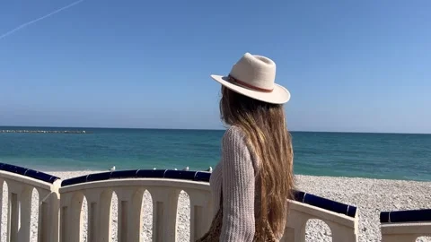 Smooth push in to woman’s face walking along the boardwalk 스톡 동영상 331472926