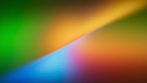 Smooth rainbow gradient animation blends vivid blue, red and orange. Video stock 325794125
