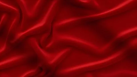 Smooth red silk fabric background with elegant soft folds and waves for lux.. Foto stock