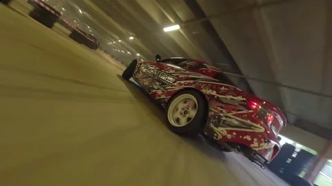 Smooth Ride: Red Mazda RX-8 Glides in Low-Angle Chase Stock Footage 327034350