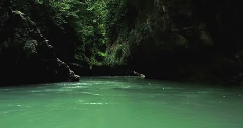 Smooth River Flow Over Rocks in Tropical Jungle Canyon Aerial Video stock 332490404