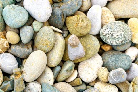 Smooth round pebbles sea texture background. Pebble on a beach. Gravel stone  Stock Photos