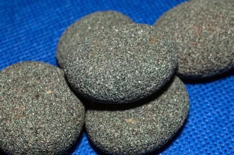 Smooth round pebbles texture background. Pebble sea beach close-up, Stock Photos