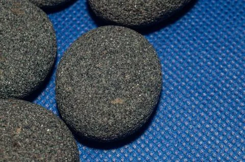 Smooth round pebbles texture background. Pebble sea beach close-up, Stock Photos