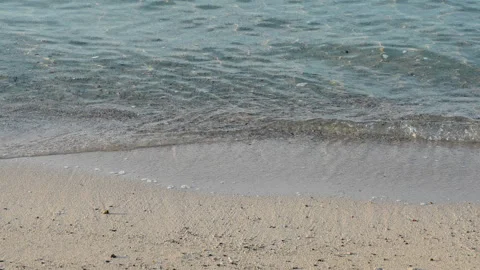 Smooth sea waves on sandy beach. Slow motion 4x, 120 fps Stock Footage 294614912