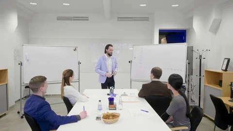 Smooth shot of the business coach performing his speech for the audience. Stock Footage 103330833