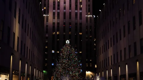 Smooth shot of Christmas Tree in Rockefeller Center With Large Groups Of Stock Footage 101114846