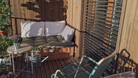 Smooth shot of pallet couch on balcony in summer. Stock Footage 109182129