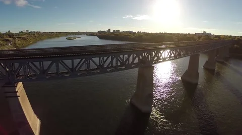 Smooth shot of a train bridge across a river Stock Footage 43315413