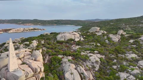 Smooth Side Drone Flight Along Lighthouse and Rocky Shore Sardegna 库存影片 333577459